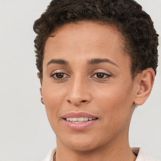 Joyful white young-adult female with short  brown hair and brown eyes