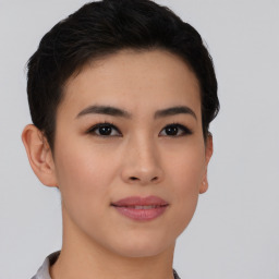 Joyful asian young-adult female with short  brown hair and brown eyes