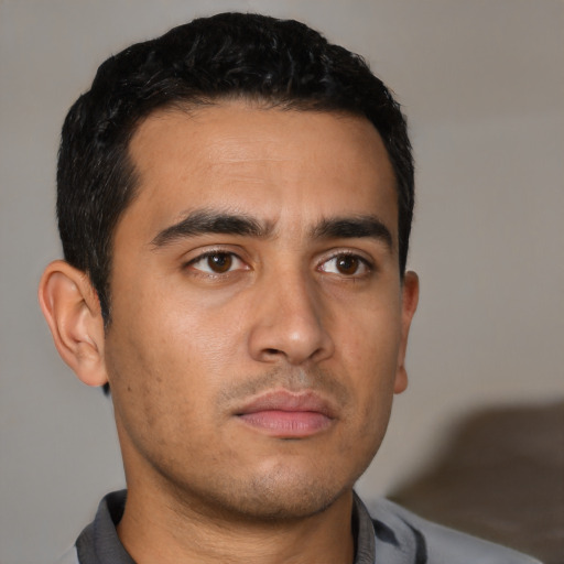 Neutral latino young-adult male with short  black hair and brown eyes