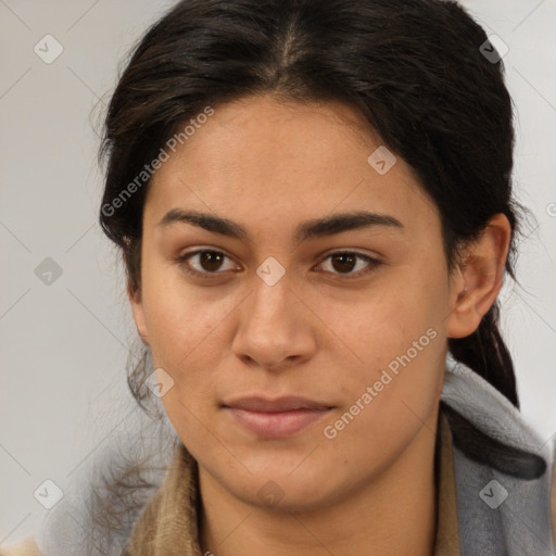 Joyful latino young-adult female with medium  brown hair and brown eyes