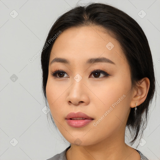 Neutral asian young-adult female with medium  black hair and brown eyes