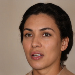 Joyful latino young-adult female with medium  brown hair and brown eyes