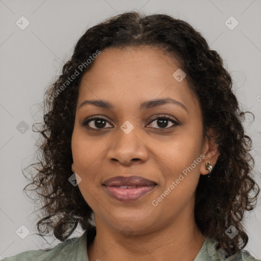 Joyful black young-adult female with medium  brown hair and brown eyes