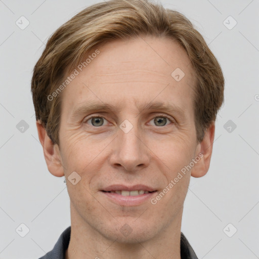 Joyful white adult male with short  brown hair and grey eyes