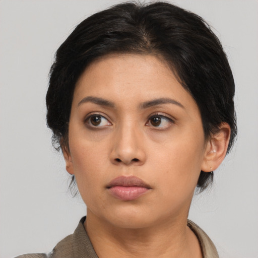 Neutral asian young-adult female with medium  black hair and brown eyes