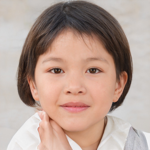 Joyful white child female with medium  brown hair and brown eyes