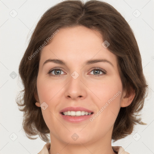 Joyful white young-adult female with medium  brown hair and green eyes