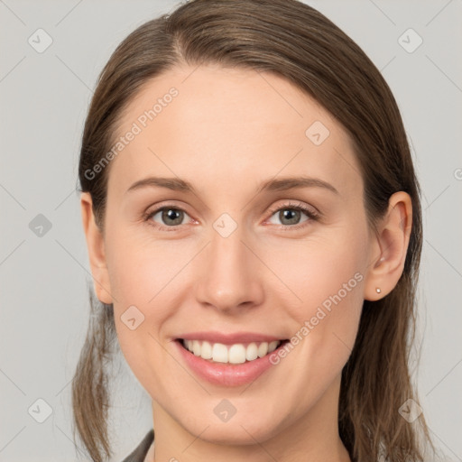 Joyful white young-adult female with medium  brown hair and grey eyes