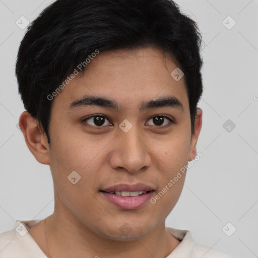 Joyful latino young-adult male with short  brown hair and brown eyes