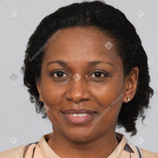 Joyful black adult female with short  brown hair and brown eyes