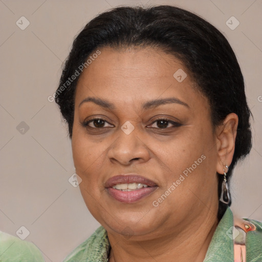 Joyful black adult female with short  brown hair and brown eyes