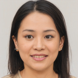 Joyful asian young-adult female with medium  brown hair and brown eyes