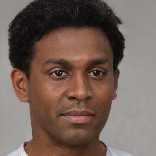 Neutral black young-adult male with short  brown hair and brown eyes