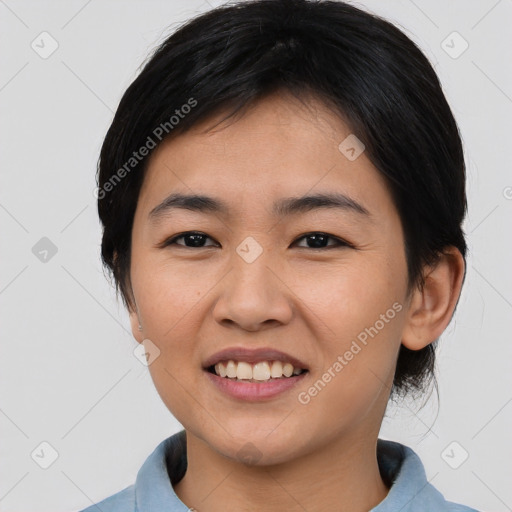 Joyful asian young-adult female with medium  black hair and brown eyes