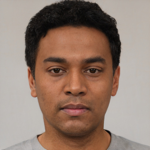 Neutral latino young-adult male with short  black hair and brown eyes