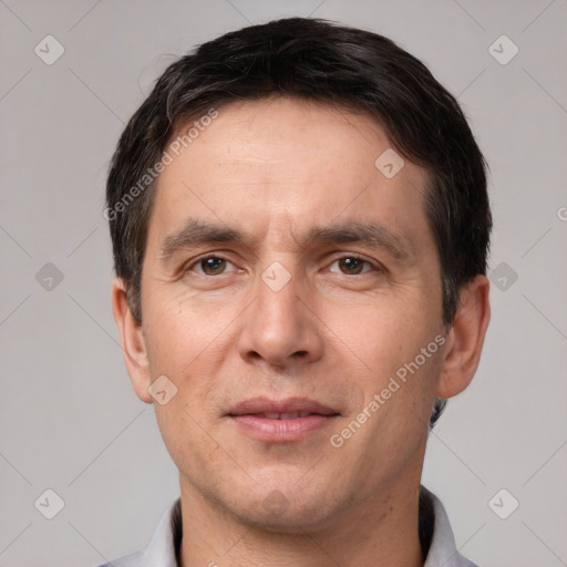 Joyful white adult male with short  brown hair and brown eyes