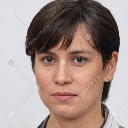 Joyful white adult female with medium  brown hair and brown eyes