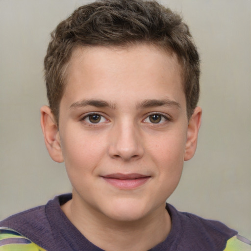 Joyful white child male with short  brown hair and brown eyes