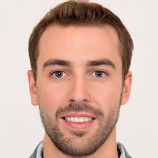 Joyful white young-adult male with short  brown hair and brown eyes