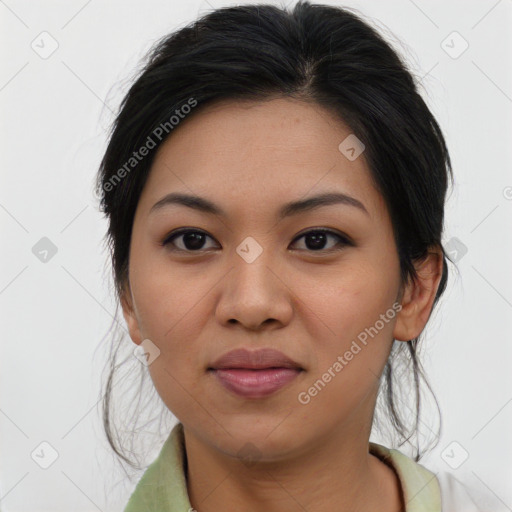 Joyful asian young-adult female with medium  black hair and brown eyes