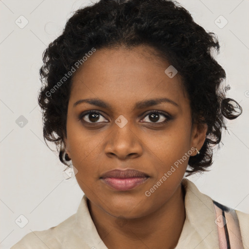 Joyful black young-adult female with long  black hair and brown eyes