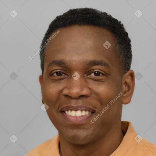 Joyful latino adult male with short  black hair and brown eyes