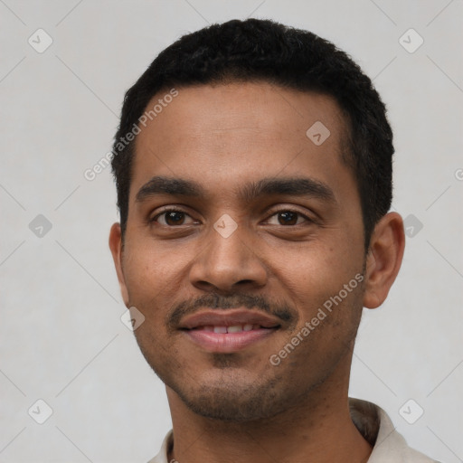 Joyful black young-adult male with short  black hair and brown eyes