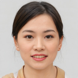 Joyful asian young-adult female with medium  brown hair and brown eyes