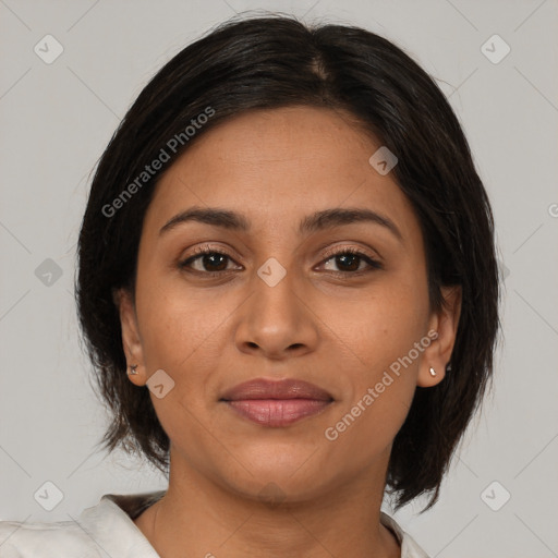 Joyful latino young-adult female with medium  brown hair and brown eyes