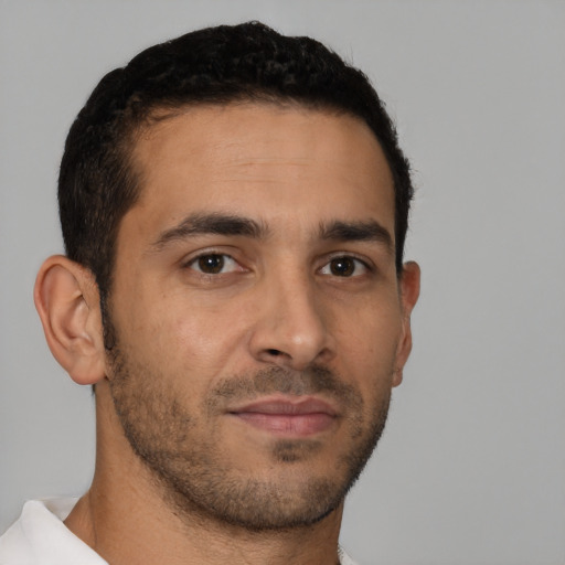 Neutral latino young-adult male with short  brown hair and brown eyes