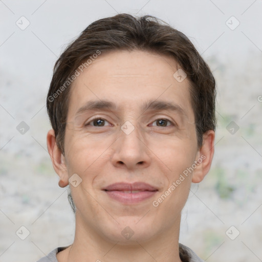 Joyful white adult male with short  brown hair and brown eyes