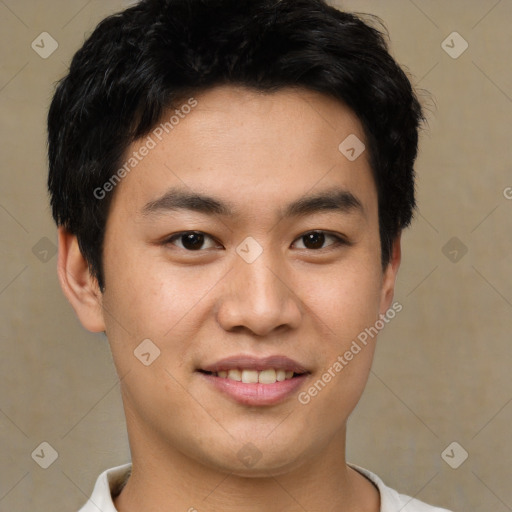 Joyful asian young-adult male with short  brown hair and brown eyes