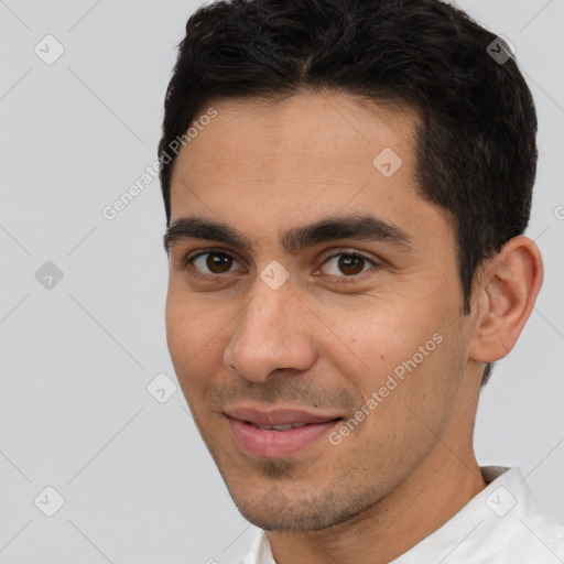 Joyful white young-adult male with short  brown hair and brown eyes