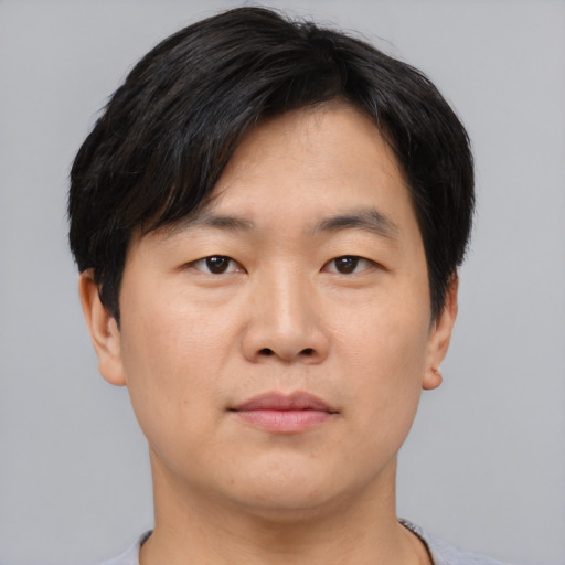Neutral asian young-adult male with short  brown hair and brown eyes