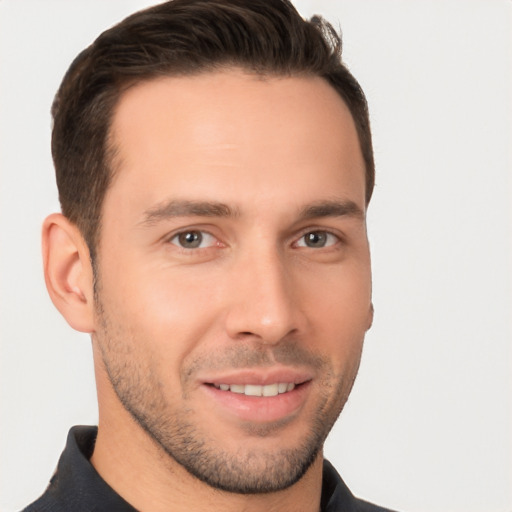 Joyful white young-adult male with short  brown hair and brown eyes