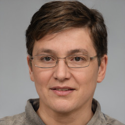 Joyful white adult male with short  brown hair and grey eyes