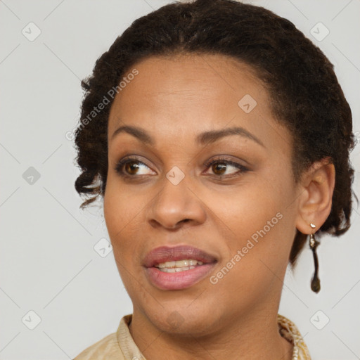 Joyful black adult female with short  brown hair and brown eyes