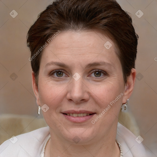 Joyful white adult female with short  brown hair and grey eyes