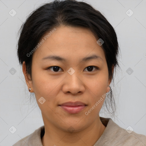 Joyful asian young-adult female with medium  brown hair and brown eyes