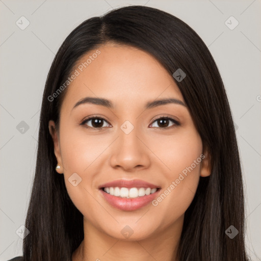 Joyful latino young-adult female with long  black hair and brown eyes