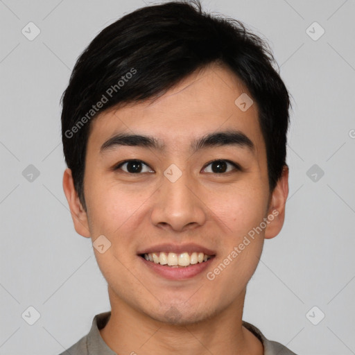 Joyful asian young-adult male with short  black hair and brown eyes