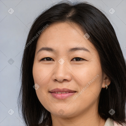 Joyful asian young-adult female with long  brown hair and brown eyes