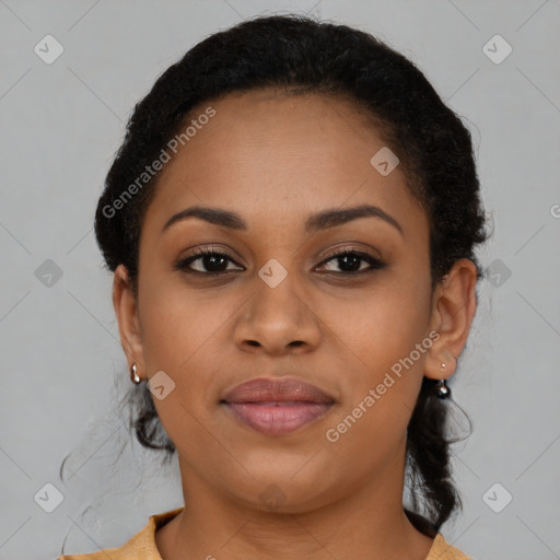 Joyful black young-adult female with short  brown hair and brown eyes