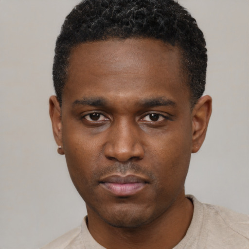 Neutral black young-adult male with short  black hair and brown eyes
