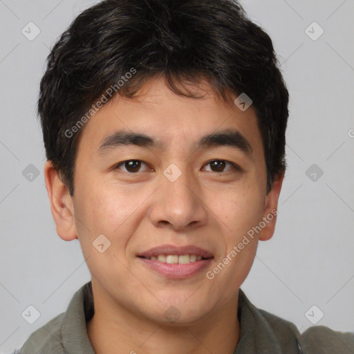 Joyful asian young-adult male with short  brown hair and brown eyes