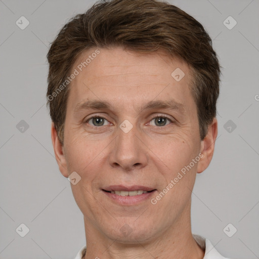 Joyful white adult male with short  brown hair and grey eyes