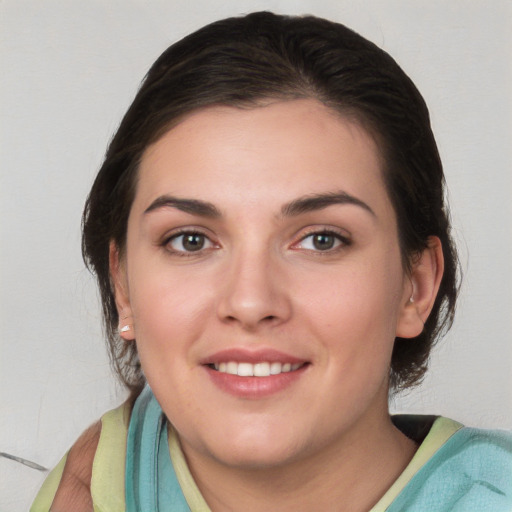 Joyful white young-adult female with medium  brown hair and brown eyes