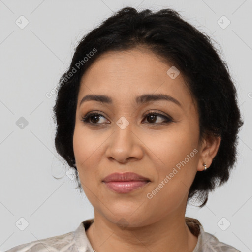 Joyful latino young-adult female with medium  brown hair and brown eyes