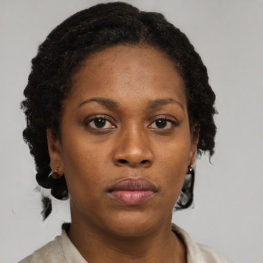 Neutral black young-adult female with short  brown hair and brown eyes