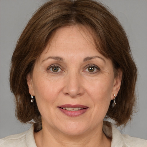 Joyful white adult female with medium  brown hair and brown eyes